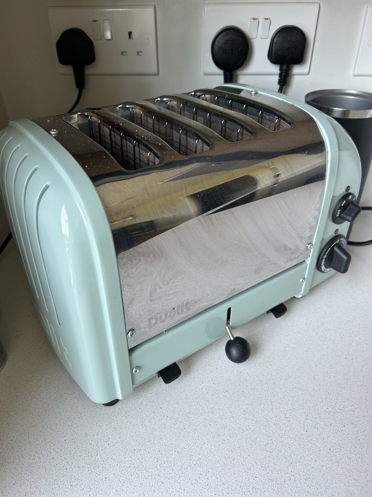 The Dualit toaster from the side, showing the lever and dial