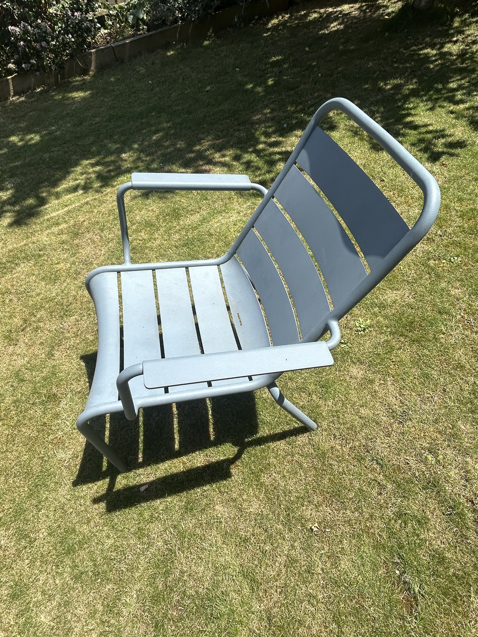 Fermob Luxembourg low chair in Storm Grey on grass