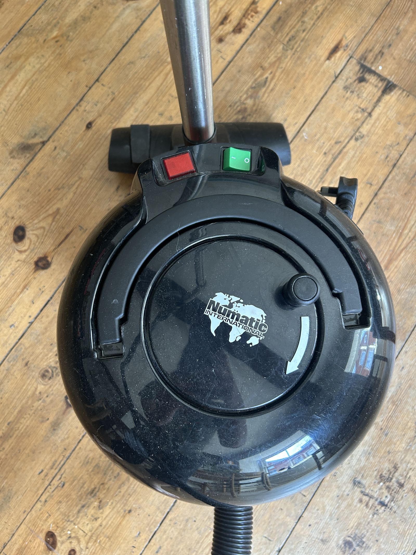 Numatic International logo on the back panel of the Henry vacuum
