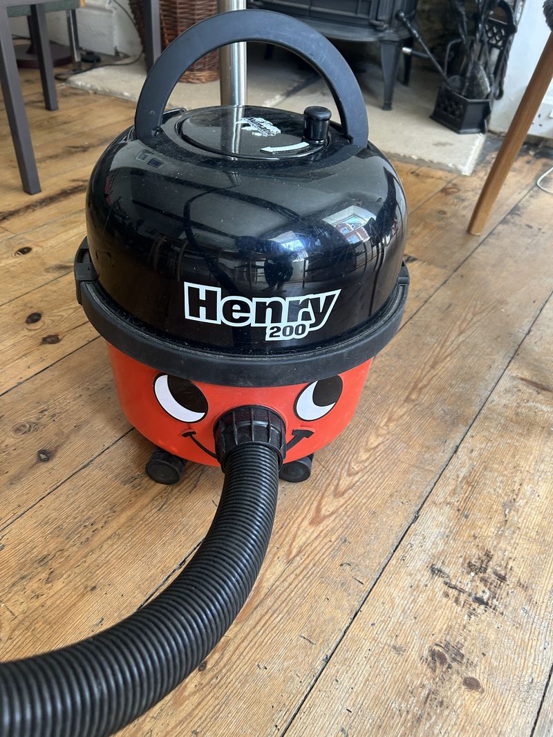 Numatic Henry 200 vacuum, red body with face
