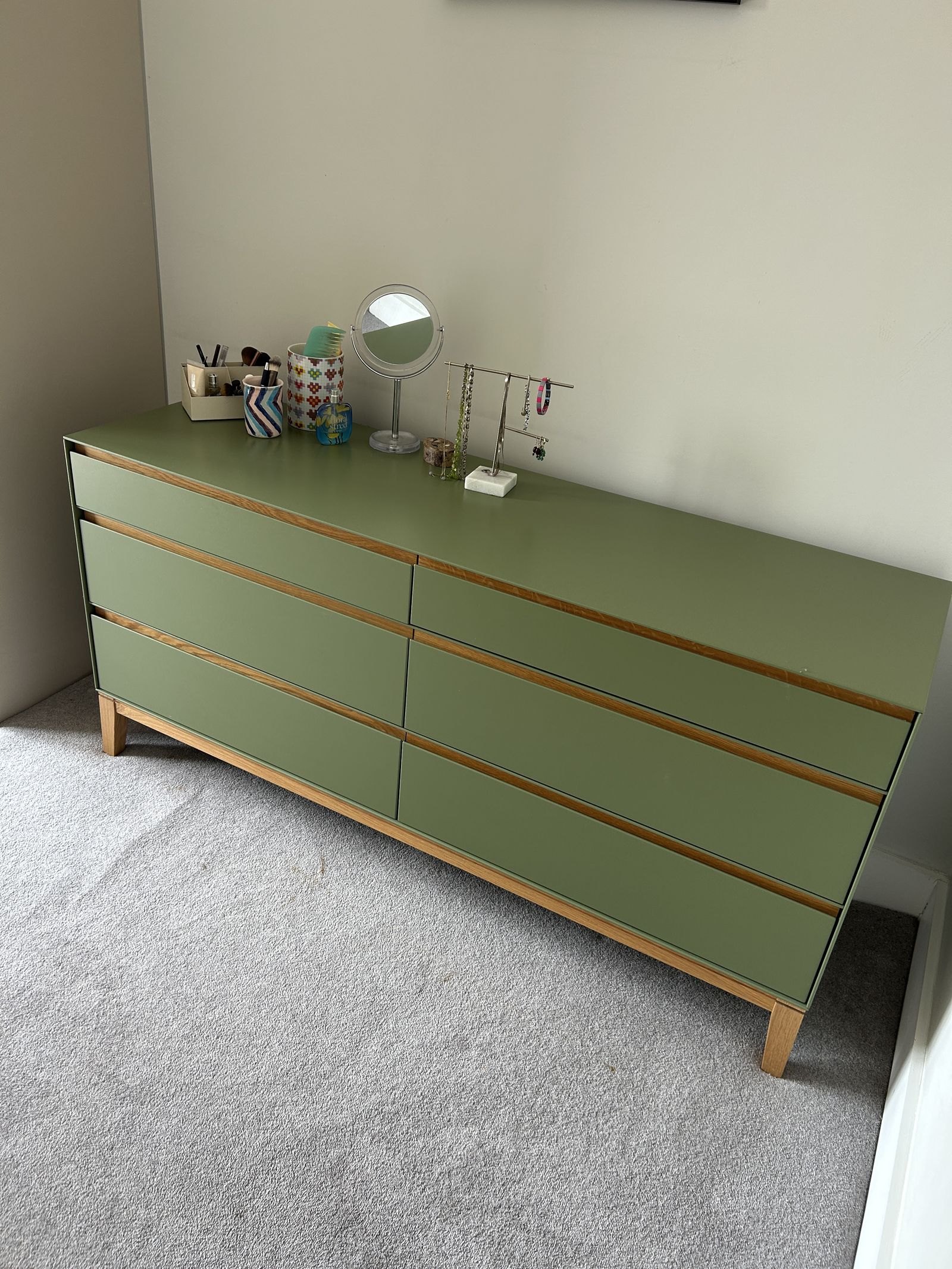 The Heal's Lars chest in the bedroom, its top used as a dressing table