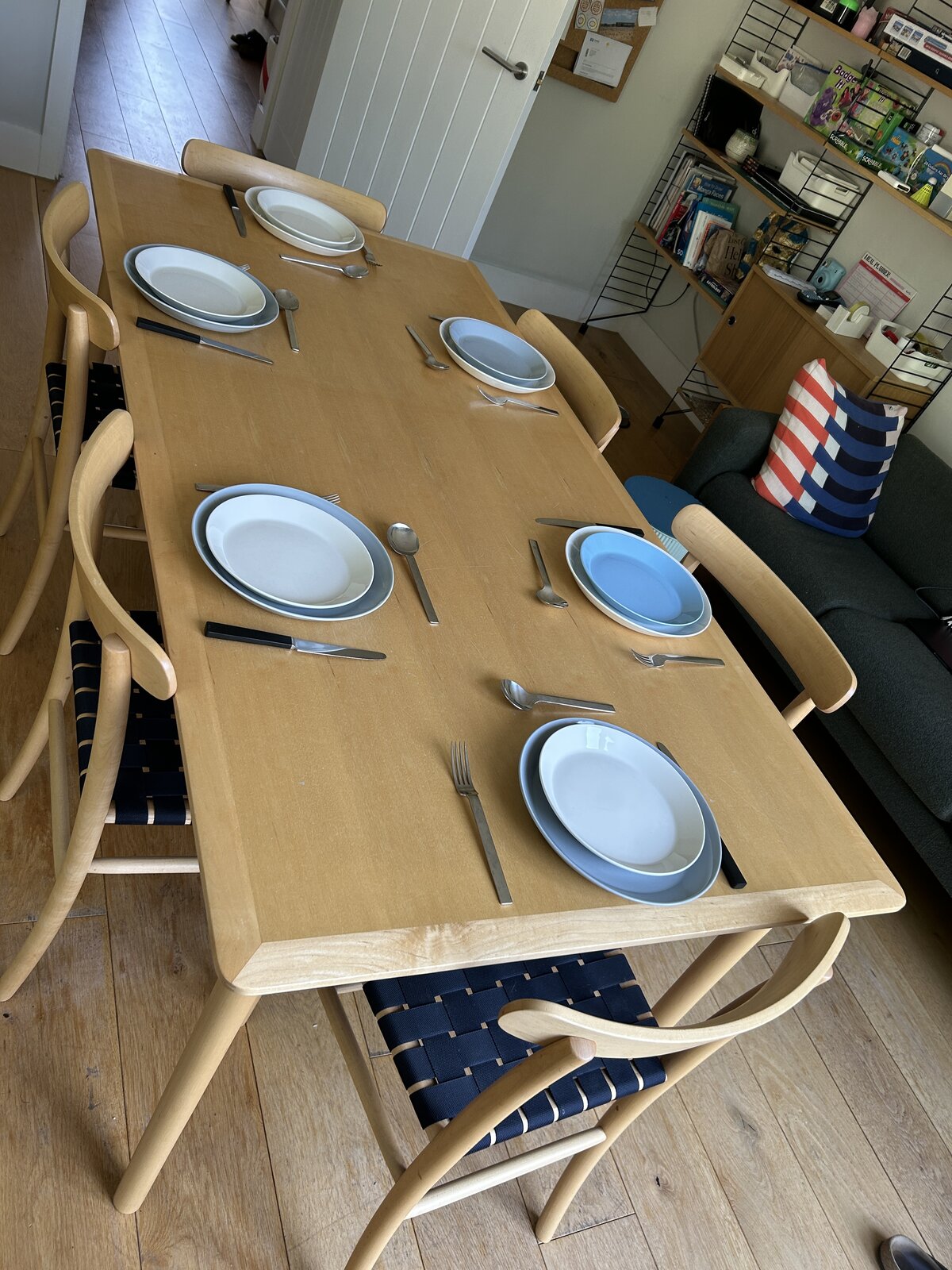 The Lightwood table set for dinner with six places laid